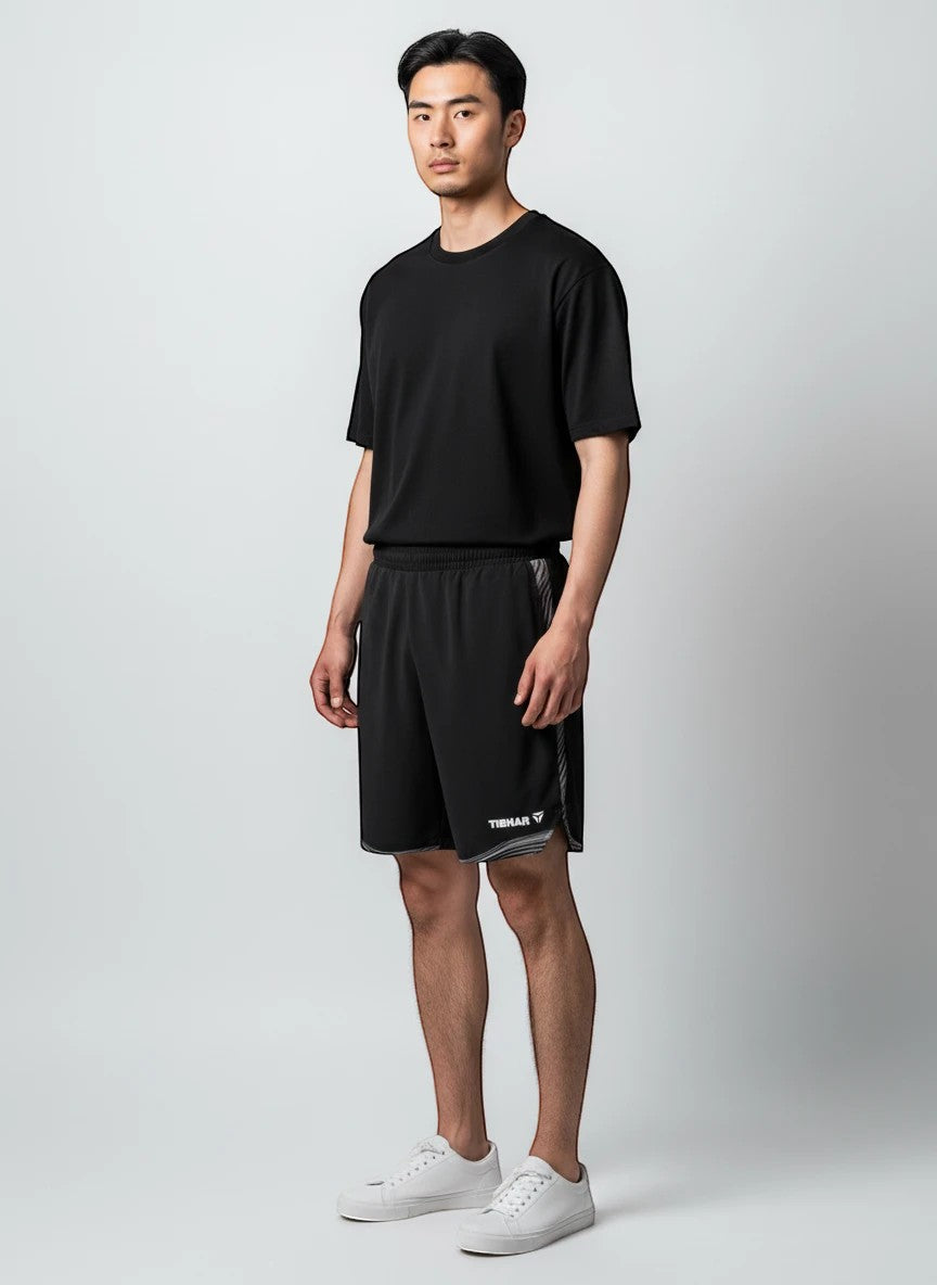TTM-Store Tibhar L2 River black and grey polyester-elastane table tennis shorts with side slits and adjustable waistband.