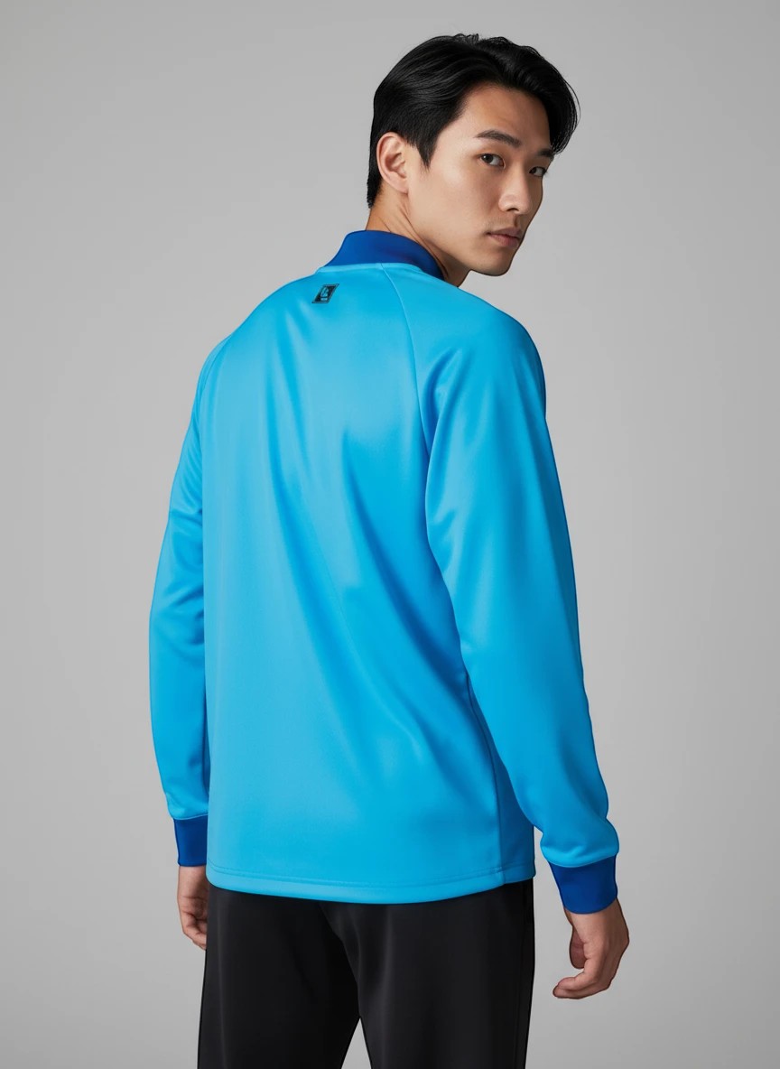 TTM-Store Tibhar L2 River training suit in turquoise, made of polyester and elastane, with a comfortable fit and zippered pockets.