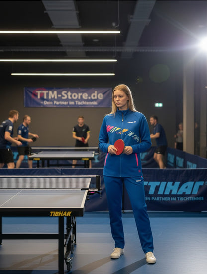 TTM-Store Tibhar L2 Underbrush royal blue and pink tracksuit with graphic detail. Soft, functional material.